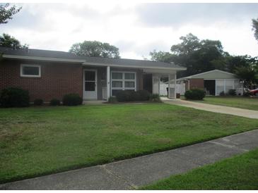Brick ranch home with carport and detached garage at 3922 Spruce Dr. # 3922, Myrtle Beach, SC 29577
