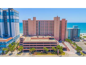 Oceanfront building with parking and surrounding landscape at 2207 S Ocean Blvd. # 1516, Myrtle Beach, SC 29577