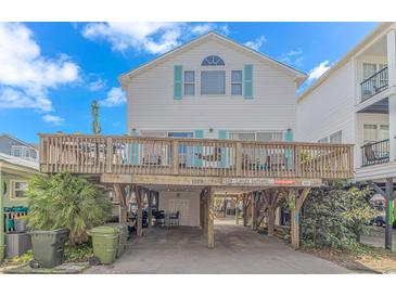 Two-story beach house with a large deck and parking underneath at 6001- 1029 S Kings Hwy., Myrtle Beach, SC 29575