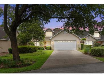 Two story home with attached garage and manicured landscaping at 723 Antigua Dr., Myrtle Beach, SC 29572