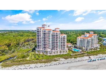 Aerial view of luxurious beachfront condo building with pool at 122 Vista Del Mar Ln. # 2-302, Myrtle Beach, SC 29572