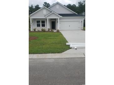Single-story home with two-car garage at 574 Tullimore Ln., Calabash, NC 28467