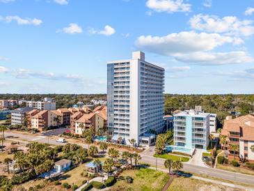 Aerial view of oceanfront high-rise building and surrounding area at 5511 N Ocean Blvd. # 306, Myrtle Beach, SC 29577