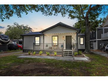 House exterior featuring a front porch and landscaping at 6001 - N-45 S Kings Hwy., Myrtle Beach, SC 29575