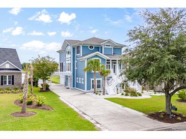 Attractive two-story house with a charming front yard and driveway at 1533 Biltmore Dr., Myrtle Beach, SC 29579