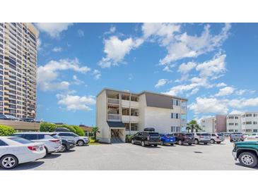 Building exterior with parking and ocean view at 9620 Shore Dr. # 303, Myrtle Beach, SC 29572