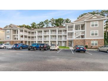 Three-story building with ample parking at 125 S Shore Blvd. # 302, Longs, SC 29568