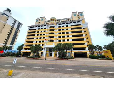 Building exterior, yellow building with parking at 2000 N Ocean Blvd. # 503, Myrtle Beach, SC 29577