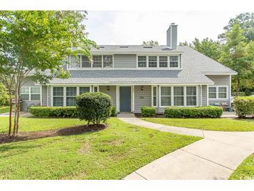 Two-story home with gray siding and landscaped yard at 1206 Benna Dr. # 4-F, Myrtle Beach, SC 29577
