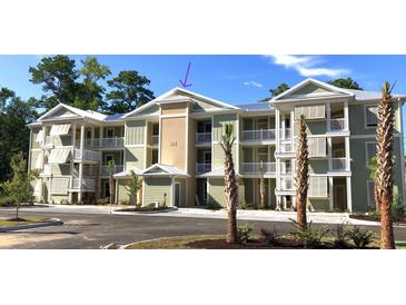 Exterior view of a three story building at 144 Puffin Dr. # 2-E, Pawleys Island, SC 29585