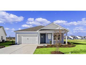 Charming one-story home with light blue siding, a white door, and a two-car garage at 3058 Deerberry Place, Longs, SC 29568