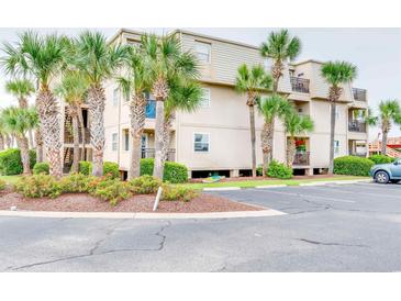 Building exterior showcasing landscaping and parking at 1582 S Waccamaw Dr. # 10, Murrells Inlet, SC 29576