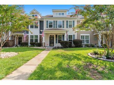 Two-story home with landscaped yard and walkway at 444 Papyrus Circle # 444, Little River, SC 29566