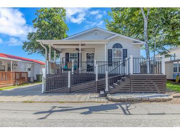 One-story home with a covered porch and ramp access at 6001 - 1819 S Kings Hwy., Myrtle Beach, SC 29575