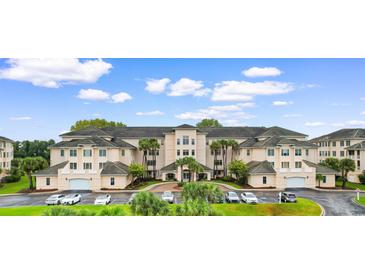 Luxury condo building with ample parking and beautiful landscaping at 2180 Waterview Dr. # 634, North Myrtle Beach, SC 29582