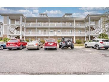 Three-story building exterior with ample parking at 800 Crumpet Ct. # 1122, Myrtle Beach, SC 29579