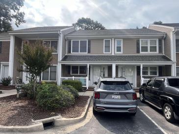 Two-story townhome with neutral siding and landscaping, offering curb appeal at 6702 Jefferson Pl. # C-3, Myrtle Beach, SC 29572