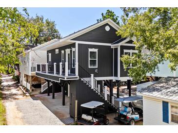 Two-story home with elevated deck and carport at 6001-N37 S Kings Hwy., Myrtle Beach, SC 29575