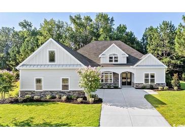 Two story home with gray siding, stone accents and a large yard at 1012 Maccoa Dr., Conway, SC 29526