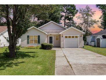 Charming one-story house with a driveway and landscaped lawn at 6458 Sweet Gum Trail, Myrtle Beach, SC 29588