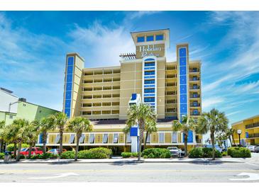 Holiday Pavilion oceanfront resort, featuring multiple stories and a welcoming entrance at 1200 N Ocean Blvd. # 308, Myrtle Beach, SC 29577