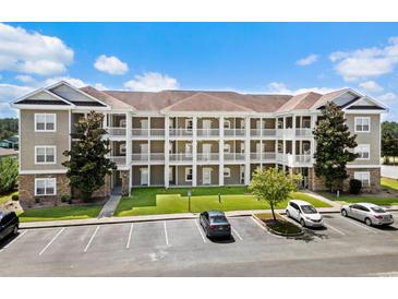 Three-story building with multiple units and parking at 124 South Shore Blvd. # 303, Longs, SC 29568