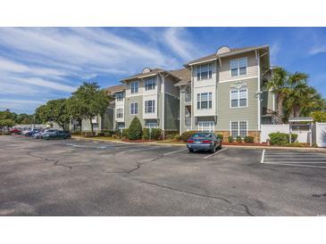 Exterior view of a multi-unit building with parking at 127 Garden City Connector # 210, Murrells Inlet, SC 29576