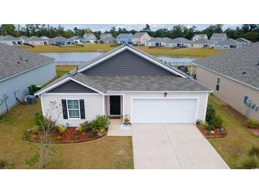 Single-story house with a white garage door at 805 Woodland Farms Circle, Aynor, SC 29511