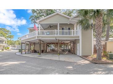 Elevated home with a large deck and parking underneath at 6001 - 7026 S Kings Hwy., Myrtle Beach, SC 29575