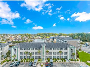 Aerial view of a waterfront community with parking and landscaping at 4516 N Plantation Harbour Dr. # H-12, Little River, SC 29566