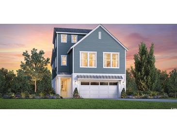 Charming two-story home with a blue exterior, white garage door, and landscaped yard at 512 9Th Ave. S, North Myrtle Beach, SC 29582