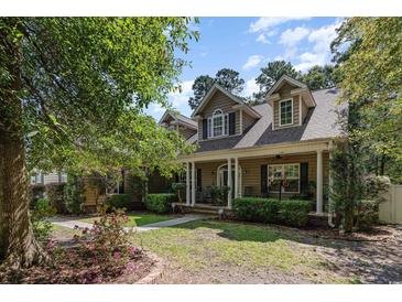 Two-story house with front porch, landscaping, and a large yard at 512 Goff Creek Ct., Myrtle Beach, SC 29579