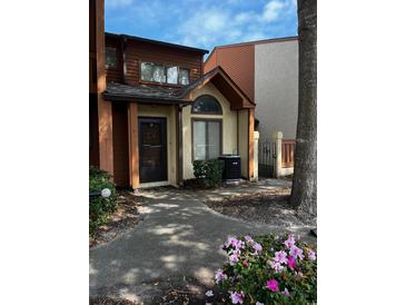 Front view of townhome with walkway and landscaping at 610 14Th Ave. S # 181, Surfside Beach, SC 29575