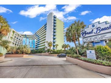 Coral Beach Resort entrance with lush landscaping at 1105 Ocean Blvd. S # 412, Myrtle Beach, SC 29577