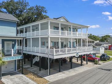 Two story house with large deck and parking at 6001 S Kings Hwy., Myrtle Beach, SC 29575