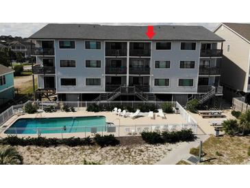 Condo building with pool and patio area at 415 N Ocean Blvd. # 302, Surfside Beach, SC 29575