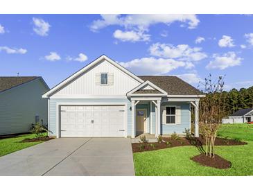 Charming light blue house with white accents, a two-car garage, and a landscaped lawn at 3022 Deerberry Place, Longs, SC 29568