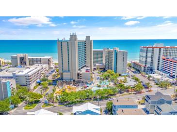 Aerial view of oceanfront resort with pools and beach access at 202 74Th Ave. N # 1249/50, Myrtle Beach, SC 29572