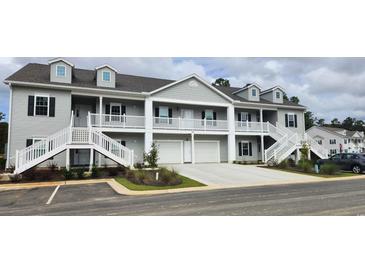 Two-story townhome with attached garage and parking at 1411 Gooseneck Place # 103, Murrells Inlet, SC 29576