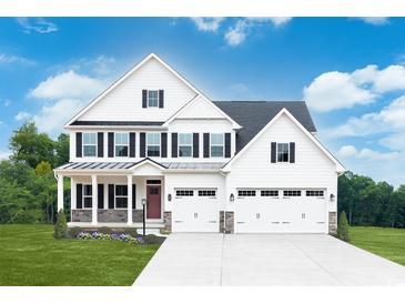 Two story white farmhouse style home with a three car garage at 400 Indigo Bay Circle, Myrtle Beach, SC 29579