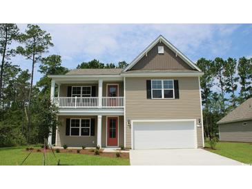 Two-story home with beige siding, red door, and a white garage door at 1889 Brook Park Pl., Conway, SC 29526