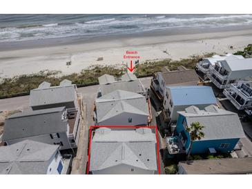 Aerial view of beach house community, highlighting a house close to beach access at 6001 S Kings Hwy., Myrtle Beach, SC 29575