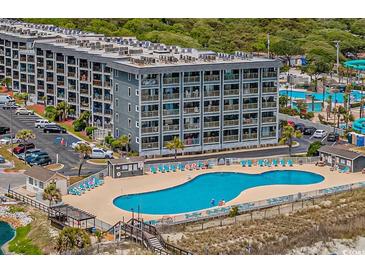 Community pool with surrounding lounge chairs at 5905 South Kings Hwy. # A246, Myrtle Beach, SC 29575