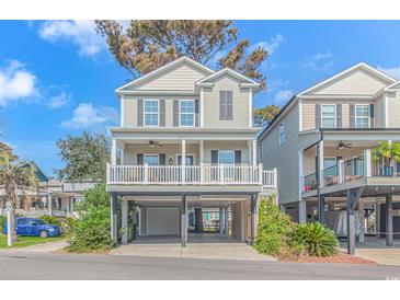 Two-story home with elevated carport and balcony at 6001-Mh 32A S Kings Hwy., Myrtle Beach, SC 29575