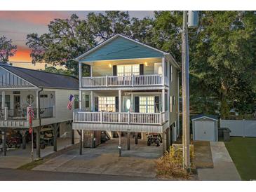 Two-story home with elevated parking and a deck at 6001 - 1870 S Kings Hwy., Myrtle Beach, SC 29575