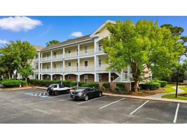 Exterior of a multi-unit residential building with parking and landscaping at 4191 Hibiscus Dr. # 304, Little River, SC 29566