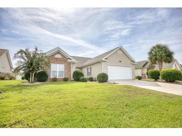 Brick and shingle ranch home with attached garage and manicured lawn at 812 Lalton Dr., Conway, SC 29526