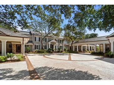 Grand two-story home with circular driveway and mature landscaping at 3601 Ocean Blvd. N, Myrtle Beach, SC 29577