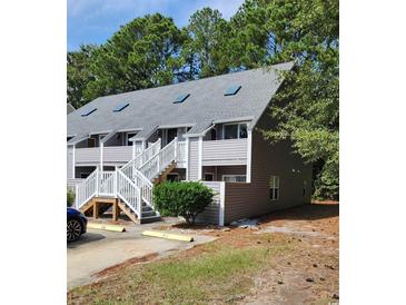 Two-story building with gray siding and white railings at 421 Cambridge Circle # F8, Murrells Inlet, SC 29576