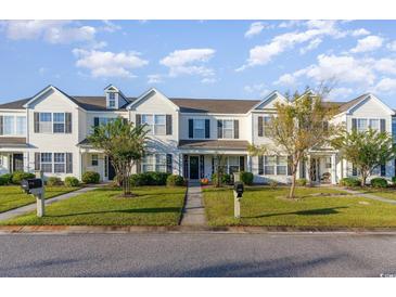 Attractive two story townhome with welcoming front porch and landscaping at 893 Barn Owl Ct. # 893, Myrtle Beach, SC 29579